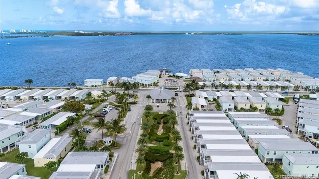 a picture of city view with lake and houses