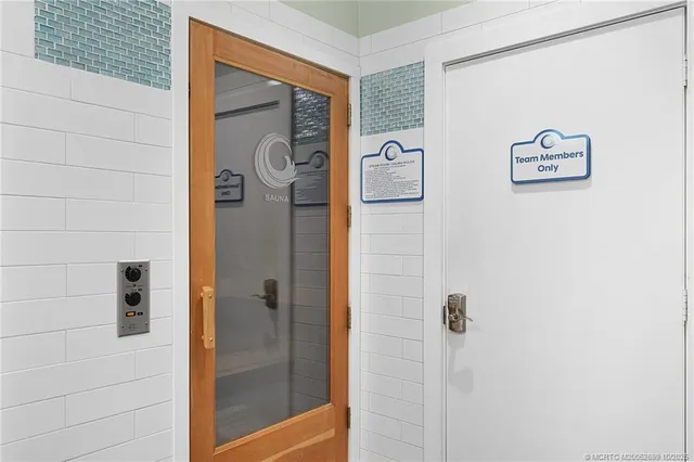 a bathroom with a shower and a sink