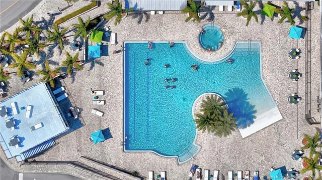 a view of a city that has lots of cars parked on the road