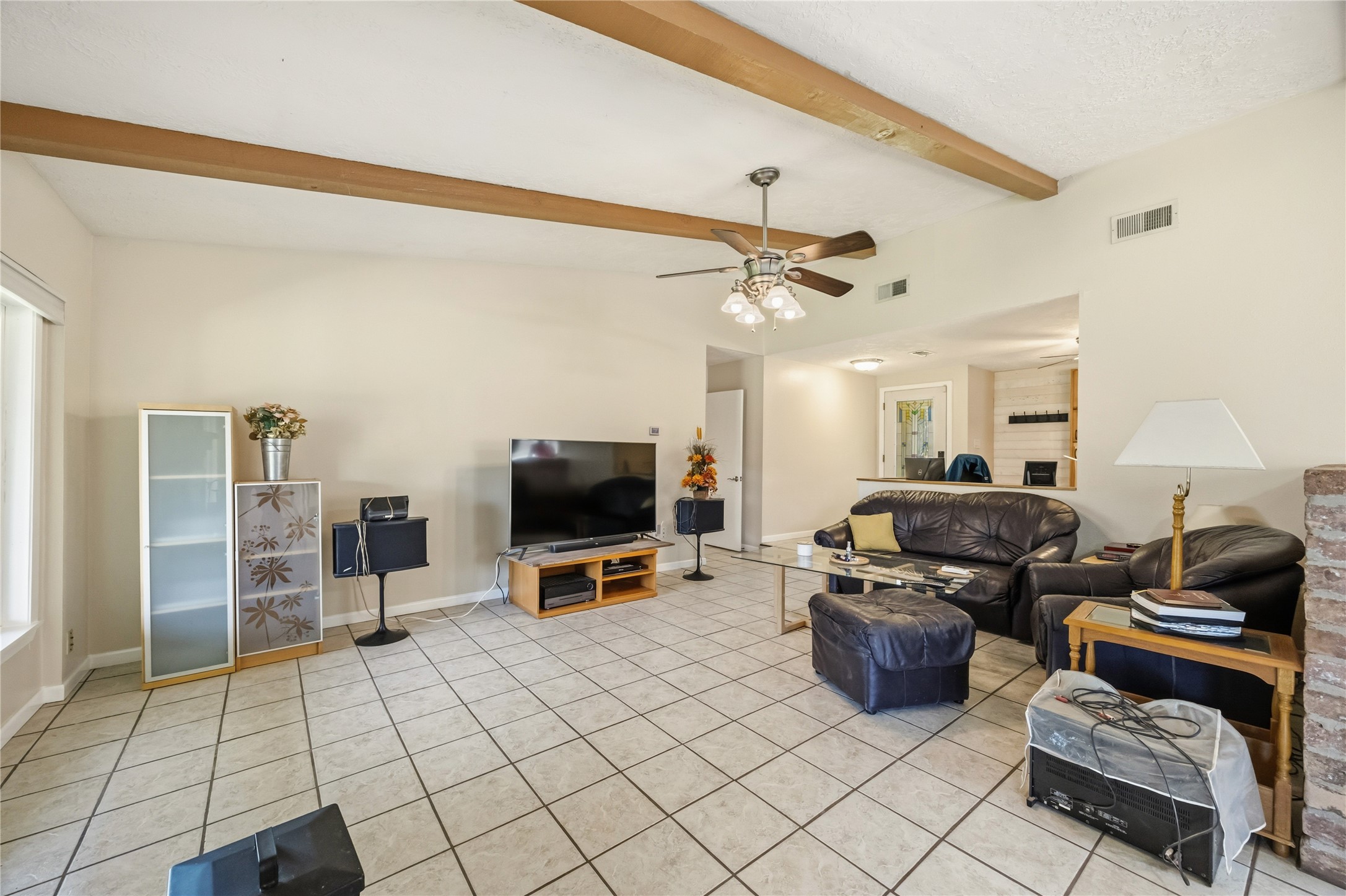 9635 Birsay Street Spring, TX 77379 - Photo 6 of 24 a living room with furniture and a flat screen tv