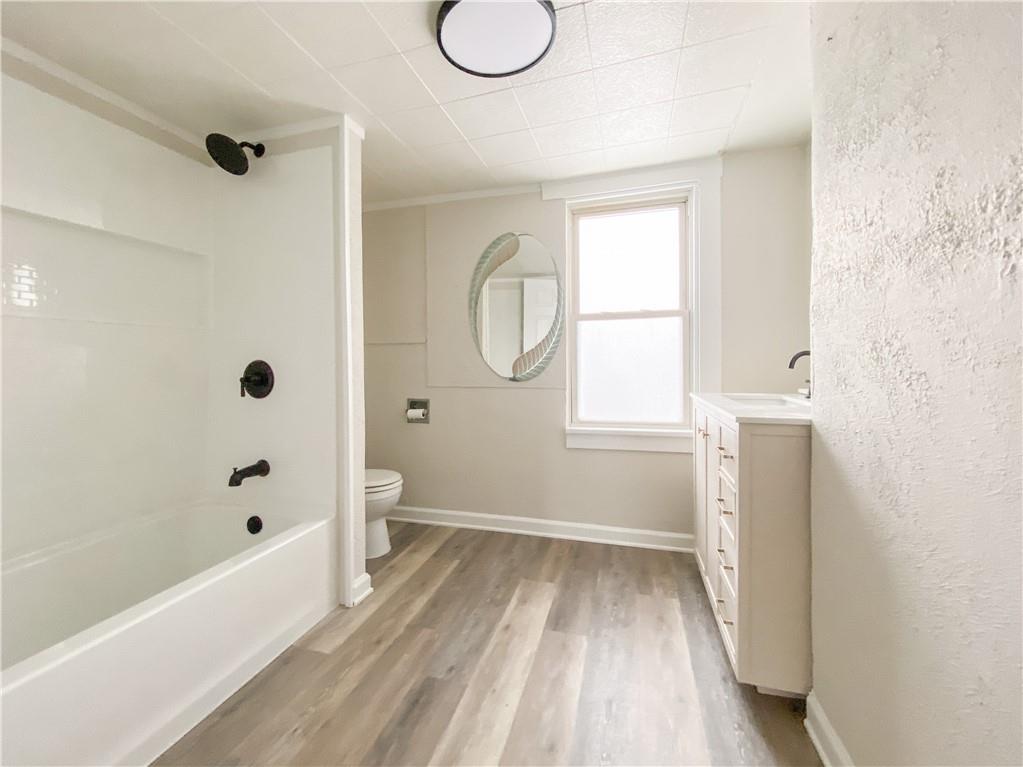 476 Mecklem Avenue Rochester, PA 15074 - Photo 20 of 28 a bathroom with a sink a toilet and shower