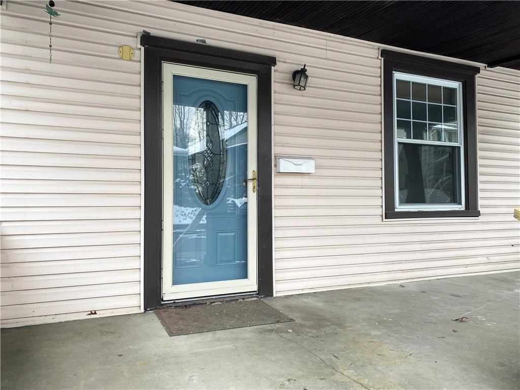 476 Mecklem Avenue Rochester, PA 15074 - Photo 5 of 28 a view of a house with a large window and a door