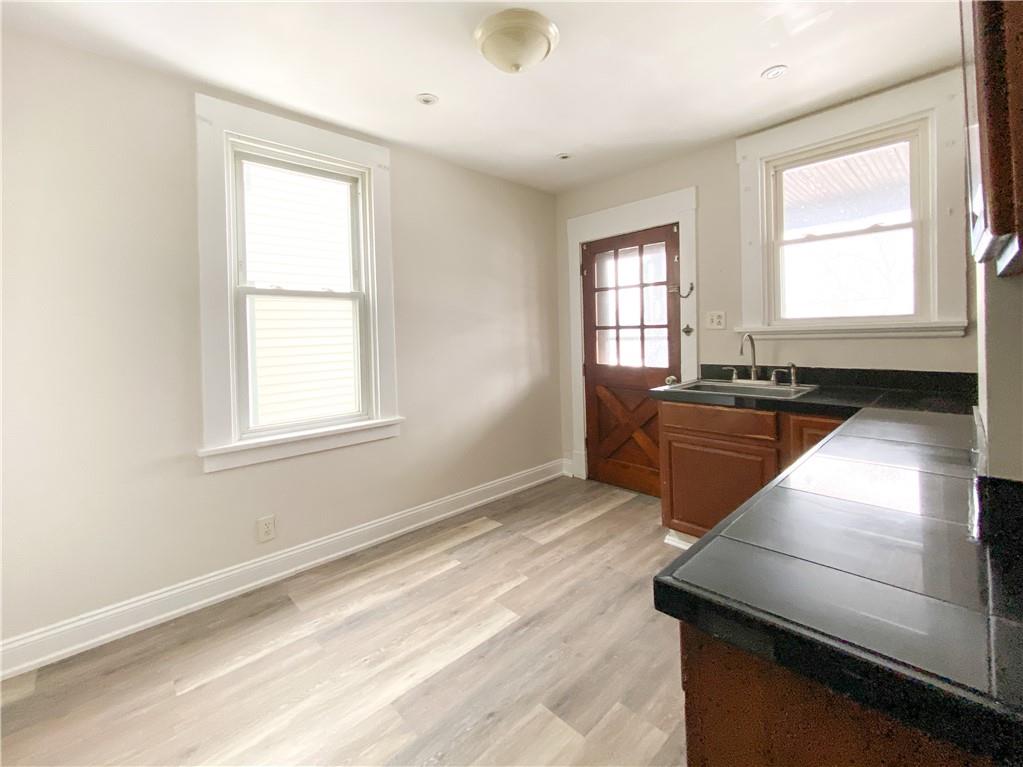 476 Mecklem Avenue Rochester, PA 15074 - Photo 10 of 28 a kitchen that has a sink stainless steel appliances and window