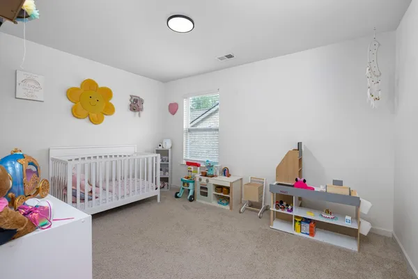 a bedroom with furniture and toys