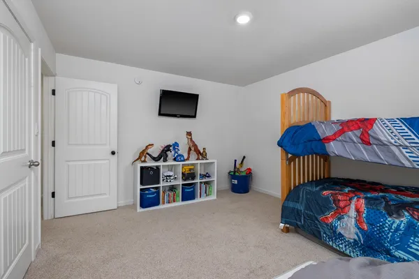 a bedroom with furniture and a bed