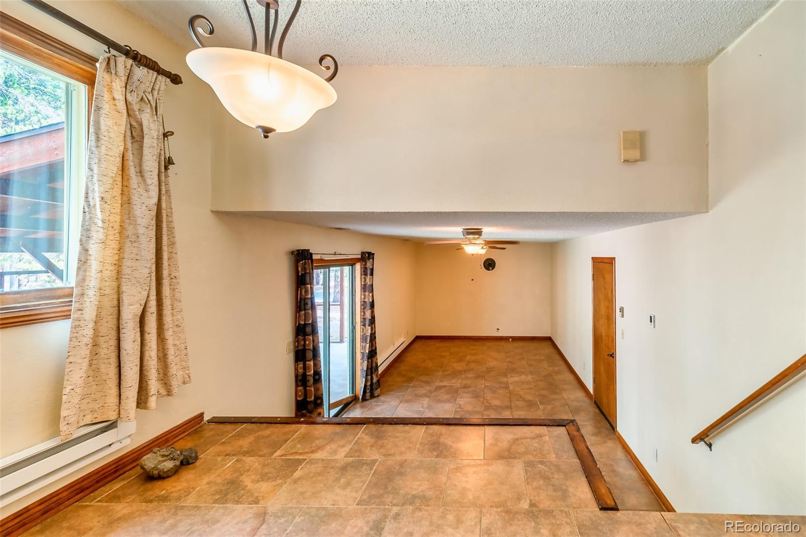 103 County Road 4C-E Leadville, CO 80461 - Photo 27 of 40 a view of a hallway with a chandelier