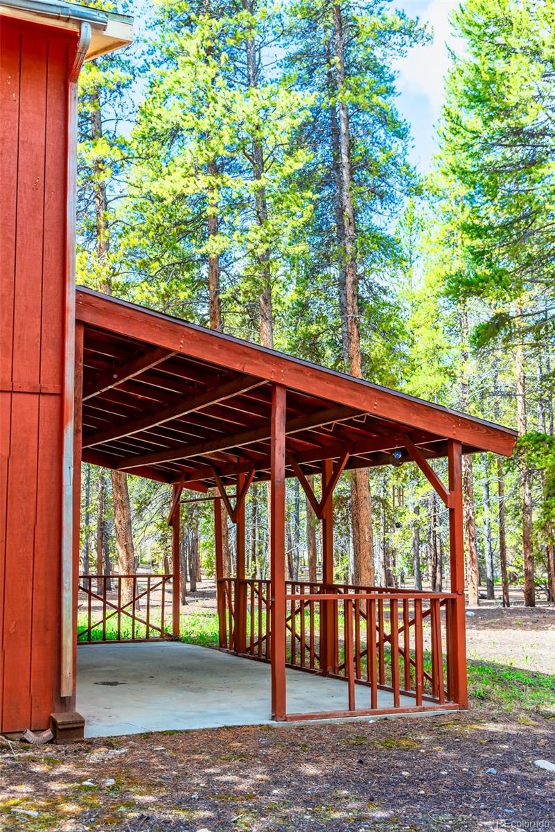 103 County Road 4C-E Leadville, CO 80461 - Photo 37 of 40 a view of porch with a table and chairs under an umbrella