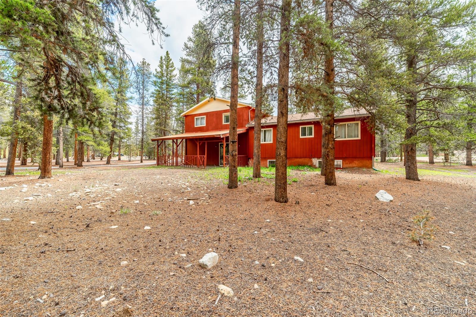 103 County Road 4C-E Leadville, CO 80461 - Photo 7 of 40 a front view of a house with a yard and garage