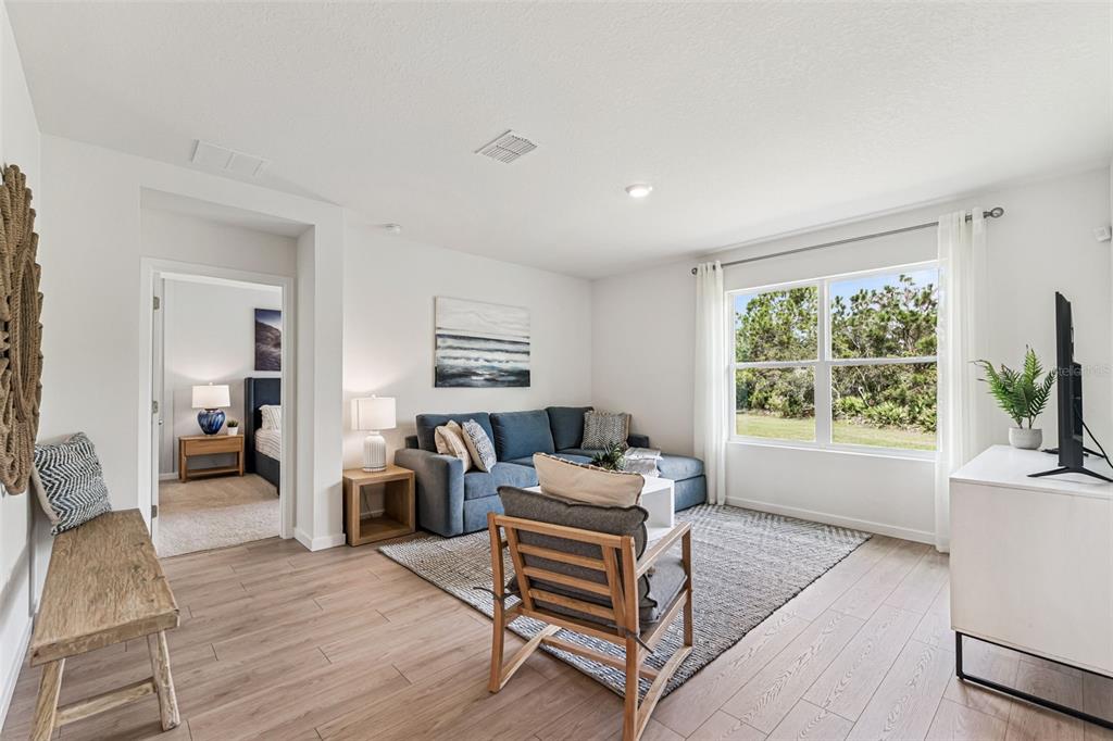 3922 Royal Azalea Way Sanford, FL 32773 - Photo 5 of 42 a living room with furniture and a window