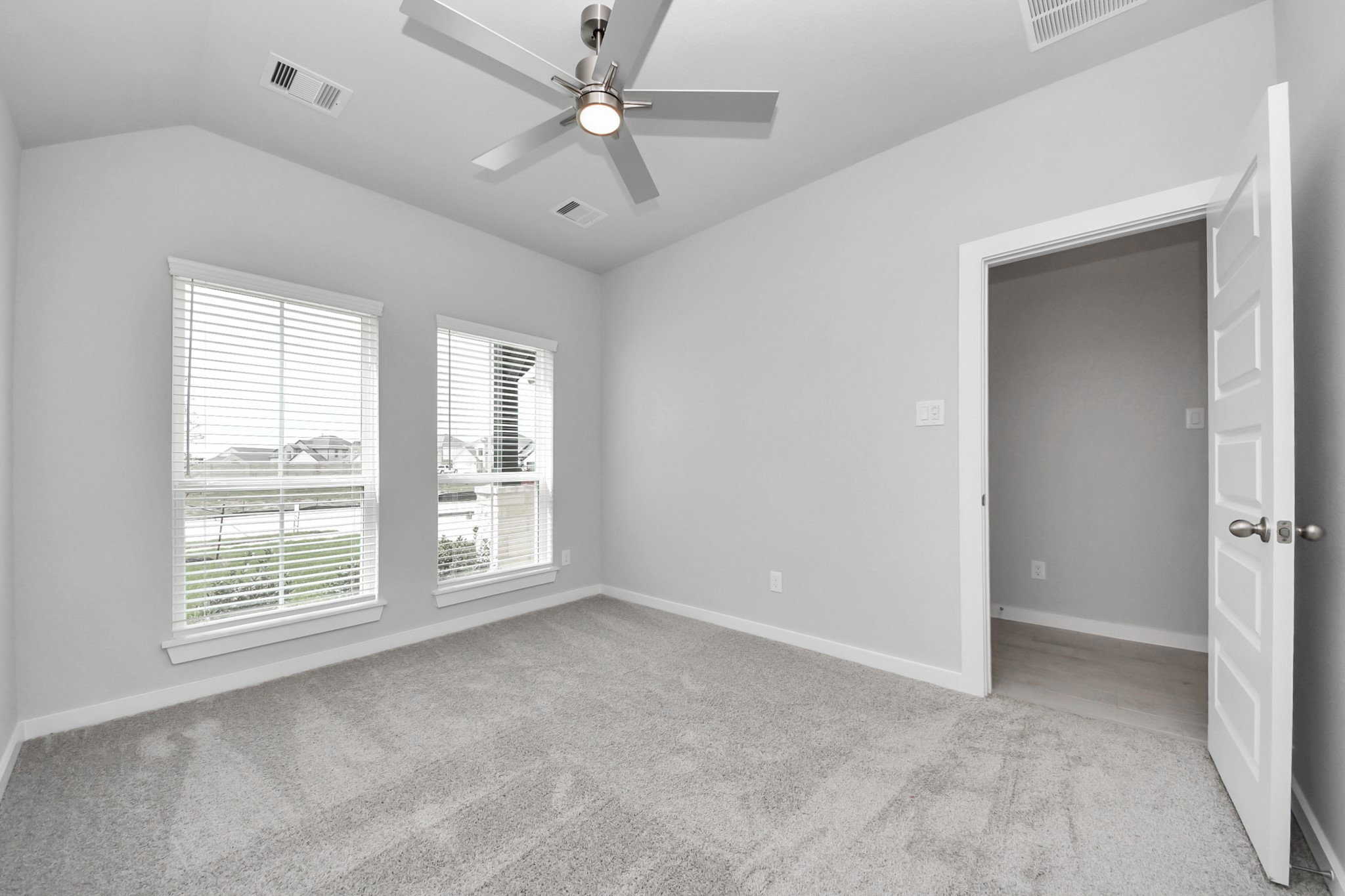 24518 Broad Park Spring, TX 77373 - Photo 4 of 29 Generously sized secondary bedrooms featuring spacious closets, soft and inviting carpeting underfoot, large windows allowing plenty of natural light, and the added touch of privacy blinds for your personal retreat. Sample photo of completed home with similar floor plan. Actual colors and selections may vary.