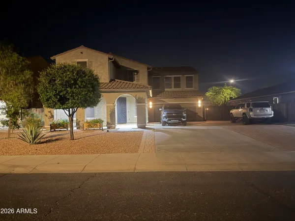 a front view of a house with parking yard