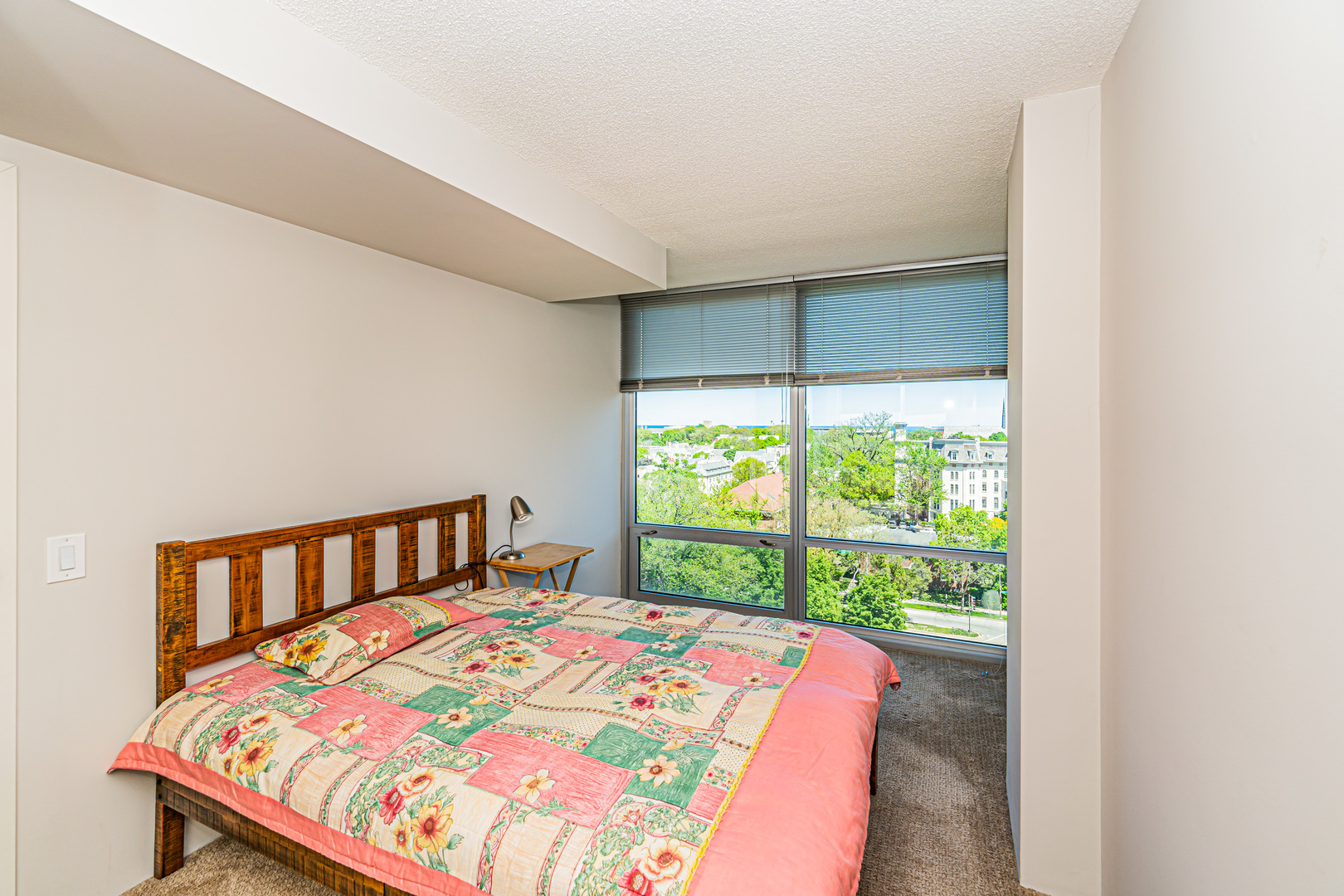 800 Elgin Road, Unit 1005 Evanston, IL 60201 - Photo 23 of 39 a bedroom with a bed and a window
