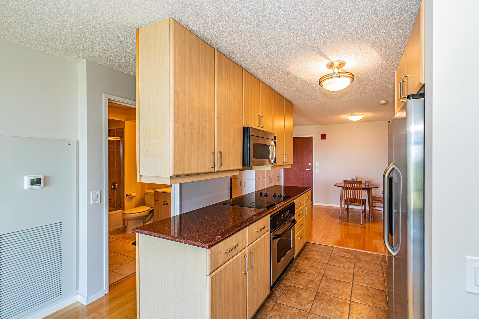 800 Elgin Road, Unit 1005 Evanston, IL 60201 - Photo 4 of 39 a kitchen with stainless steel appliances granite countertop a sink and cabinets