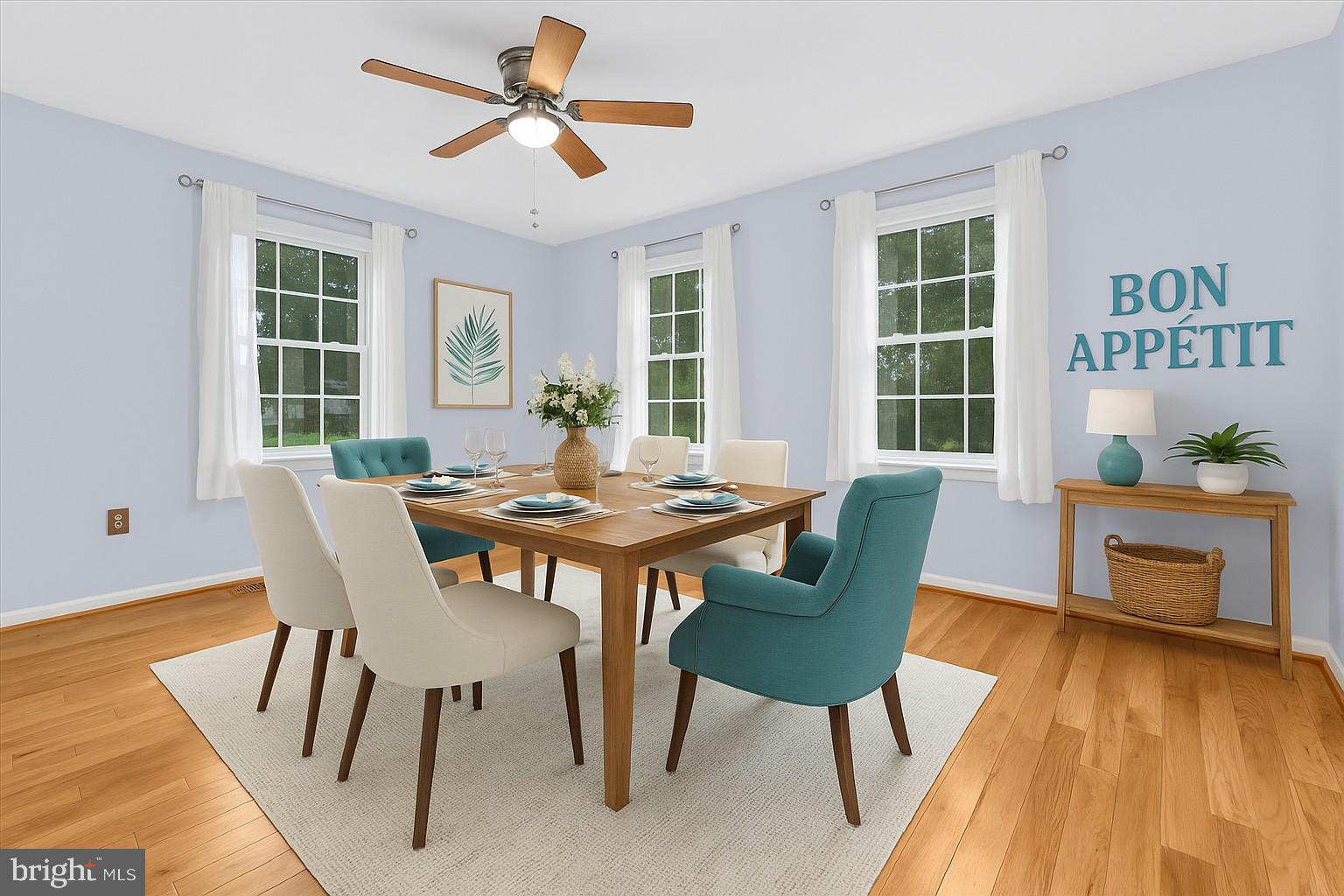 931 Oakleigh Beach Road Baltimore, MD 21222 - Photo 13 of 52 a view of a dining room with furniture window and wooden floor