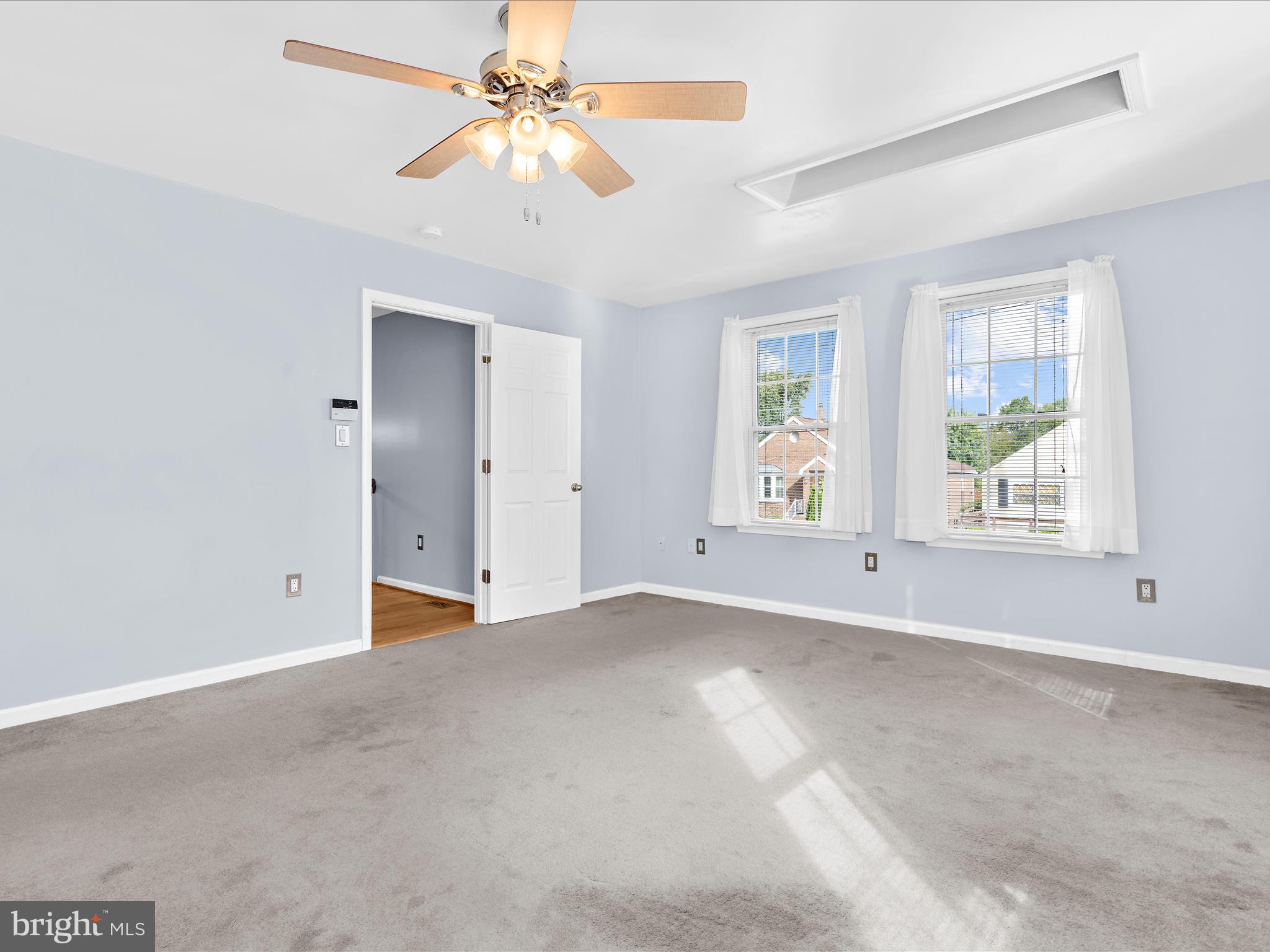 931 Oakleigh Beach Road Baltimore, MD 21222 - Photo 17 of 52 an empty room with windows and fan