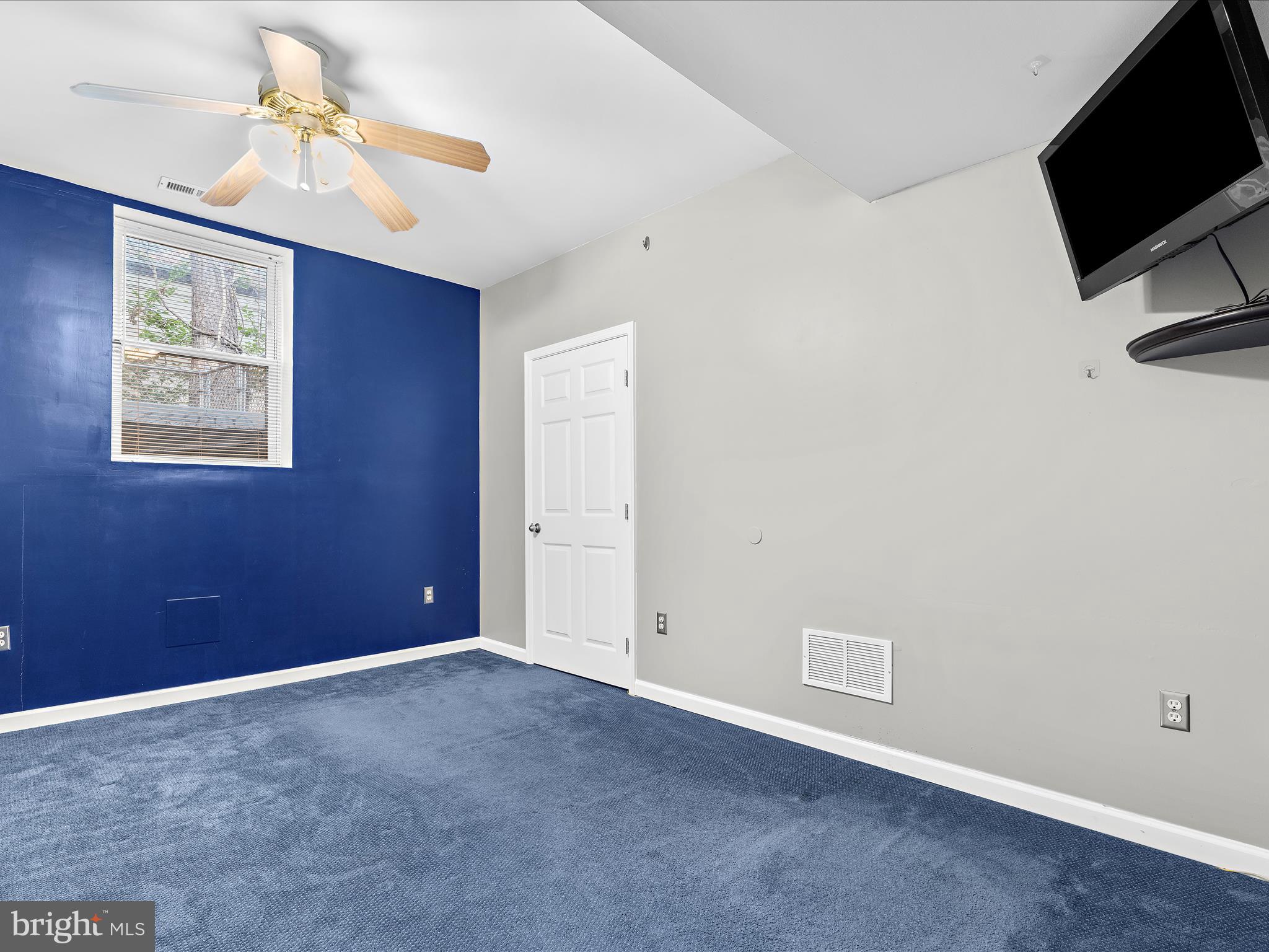 931 Oakleigh Beach Road Baltimore, MD 21222 - Photo 32 of 52 a view of an empty room with a ceiling fan