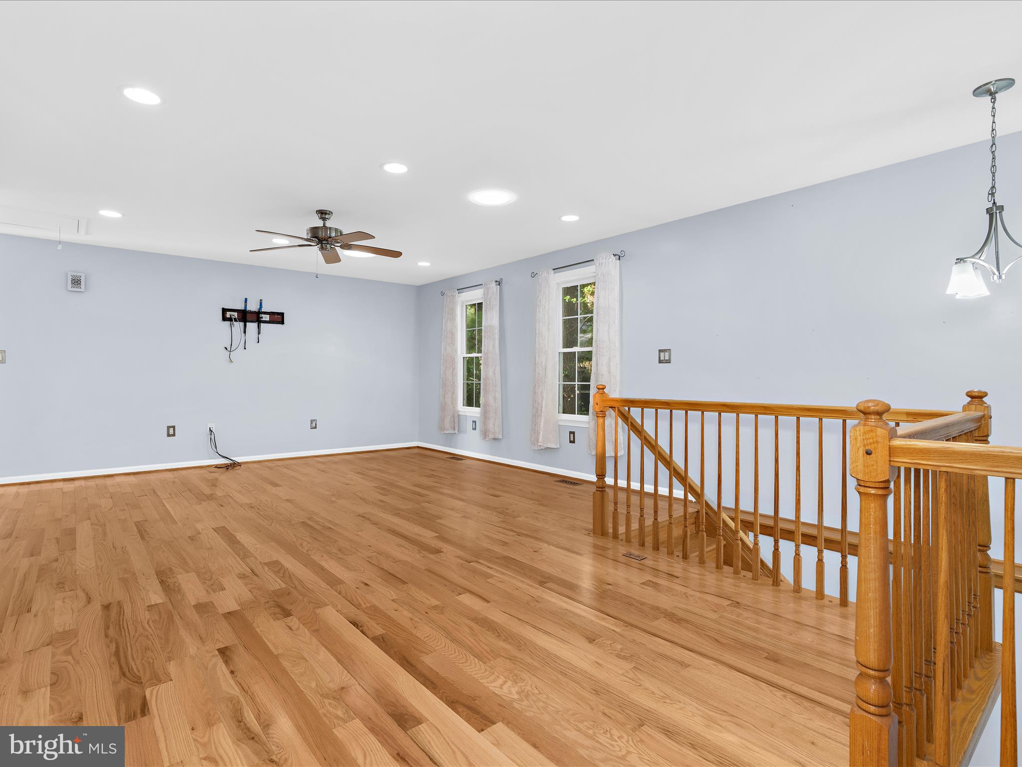 931 Oakleigh Beach Road Baltimore, MD 21222 - Photo 7 of 52 a view of a hallway with wooden floor and windows