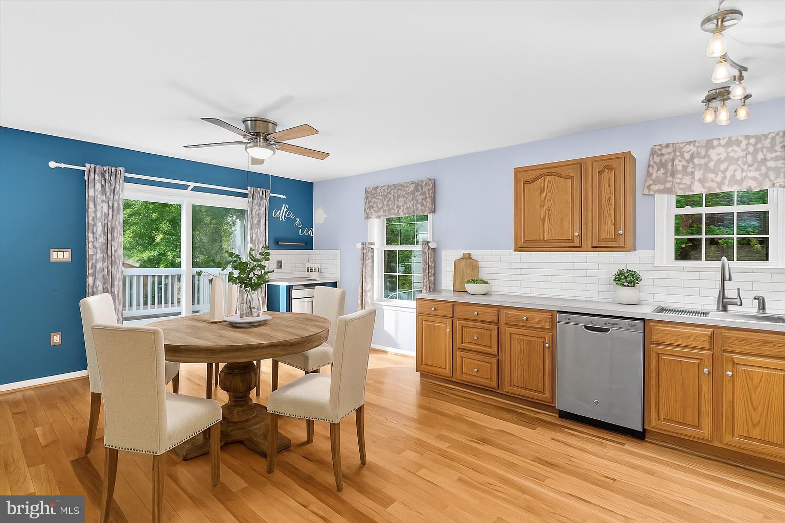 931 Oakleigh Beach Road Baltimore, MD 21222 - Photo 8 of 52 a view of a dining room with furniture window and wooden floor