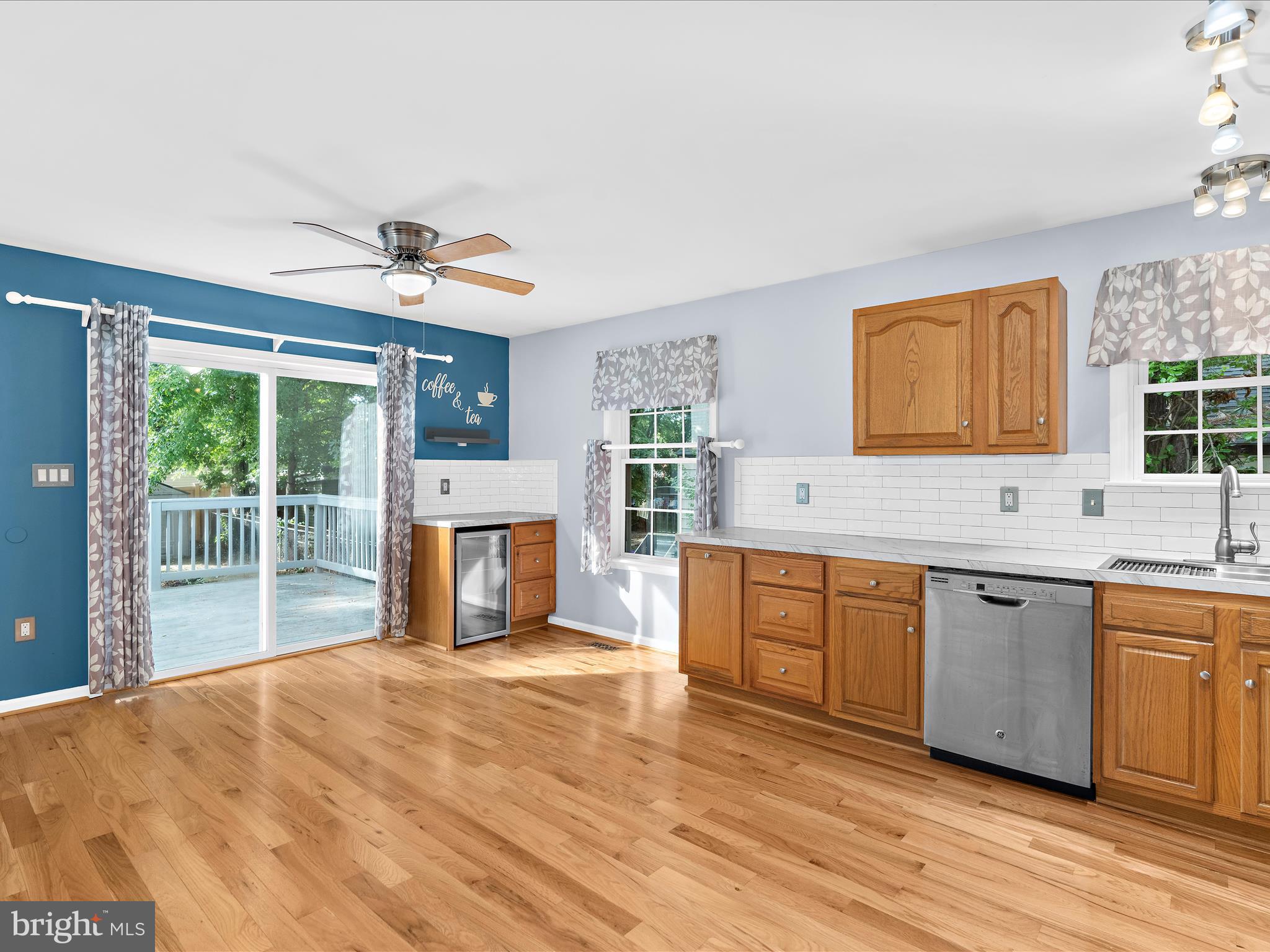 931 Oakleigh Beach Road Baltimore, MD 21222 - Photo 9 of 52 a large kitchen with stainless steel appliances granite countertop a stove sink and cabinets