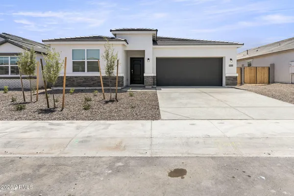 a front view of a house with garage