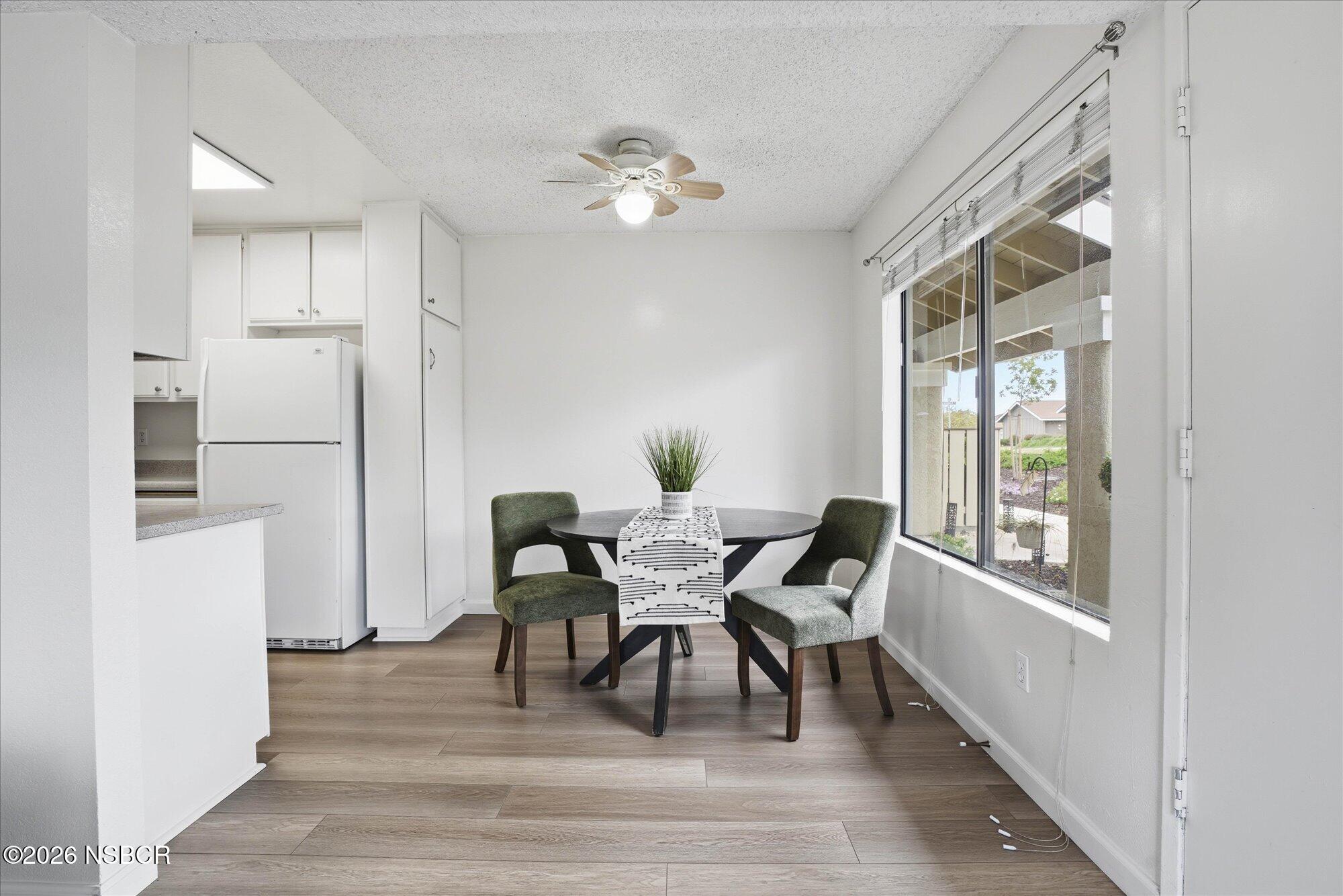 1192 Sumner Place, Unit D Santa Maria, CA 93455 - Photo 5 of 18 a view of a dining room with furniture and window