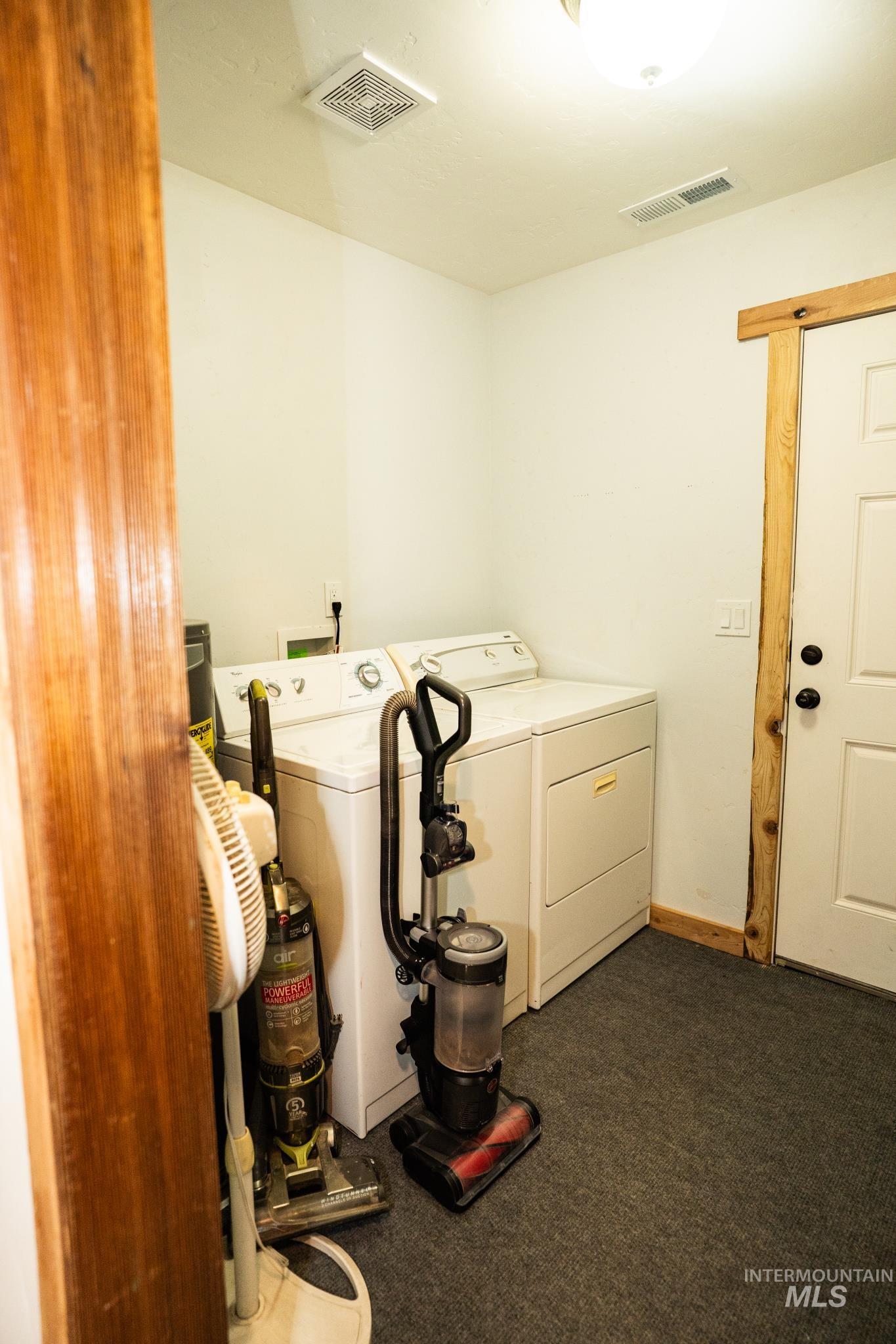 22 West Prospectors Drive Cascade, ID 83611 - Photo 13 of 25 Washroom with washing machine and dryer and dark colored carpet