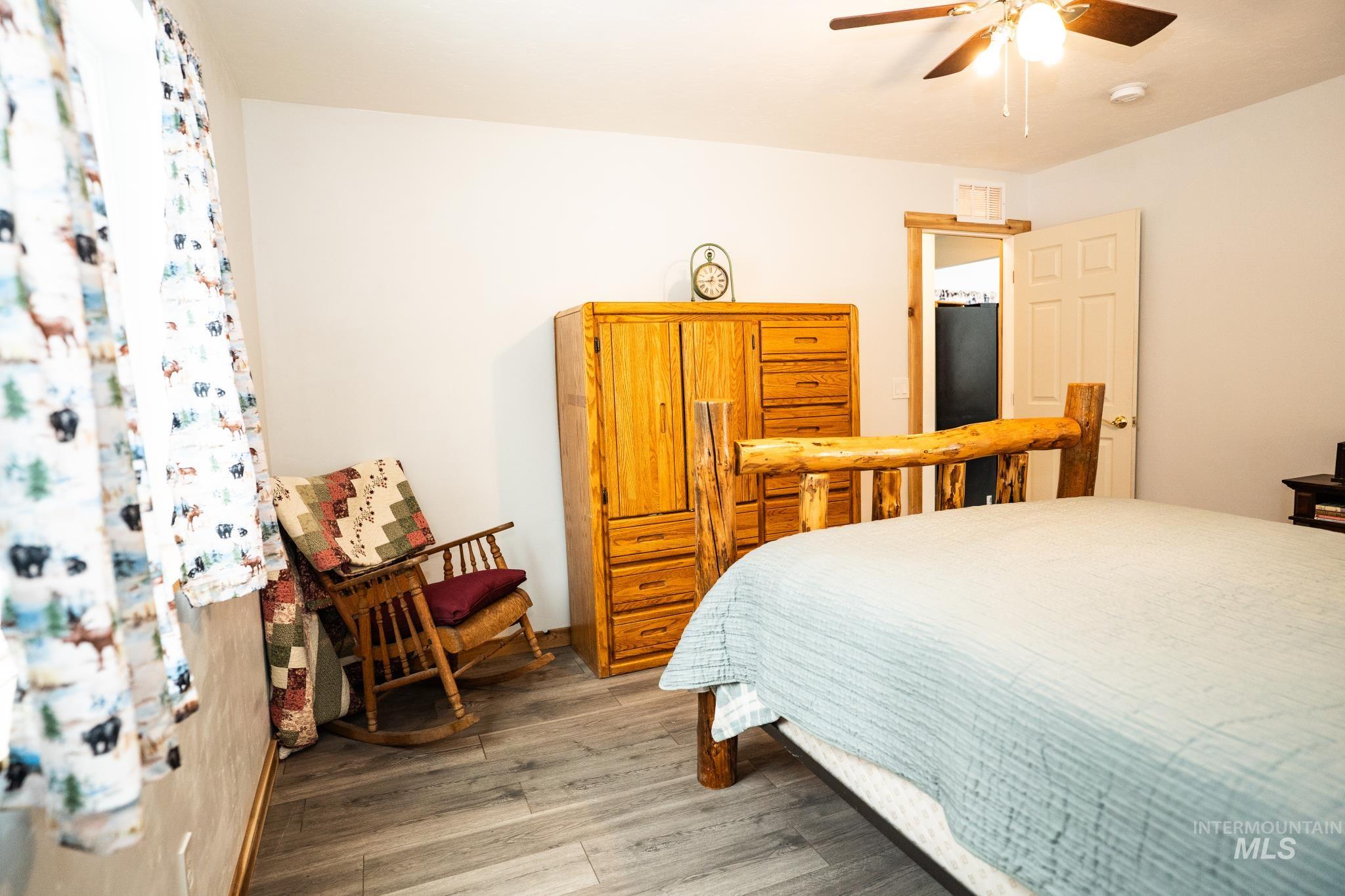 22 West Prospectors Drive Cascade, ID 83611 - Photo 17 of 25 Bedroom with wood finished floors and a ceiling fan