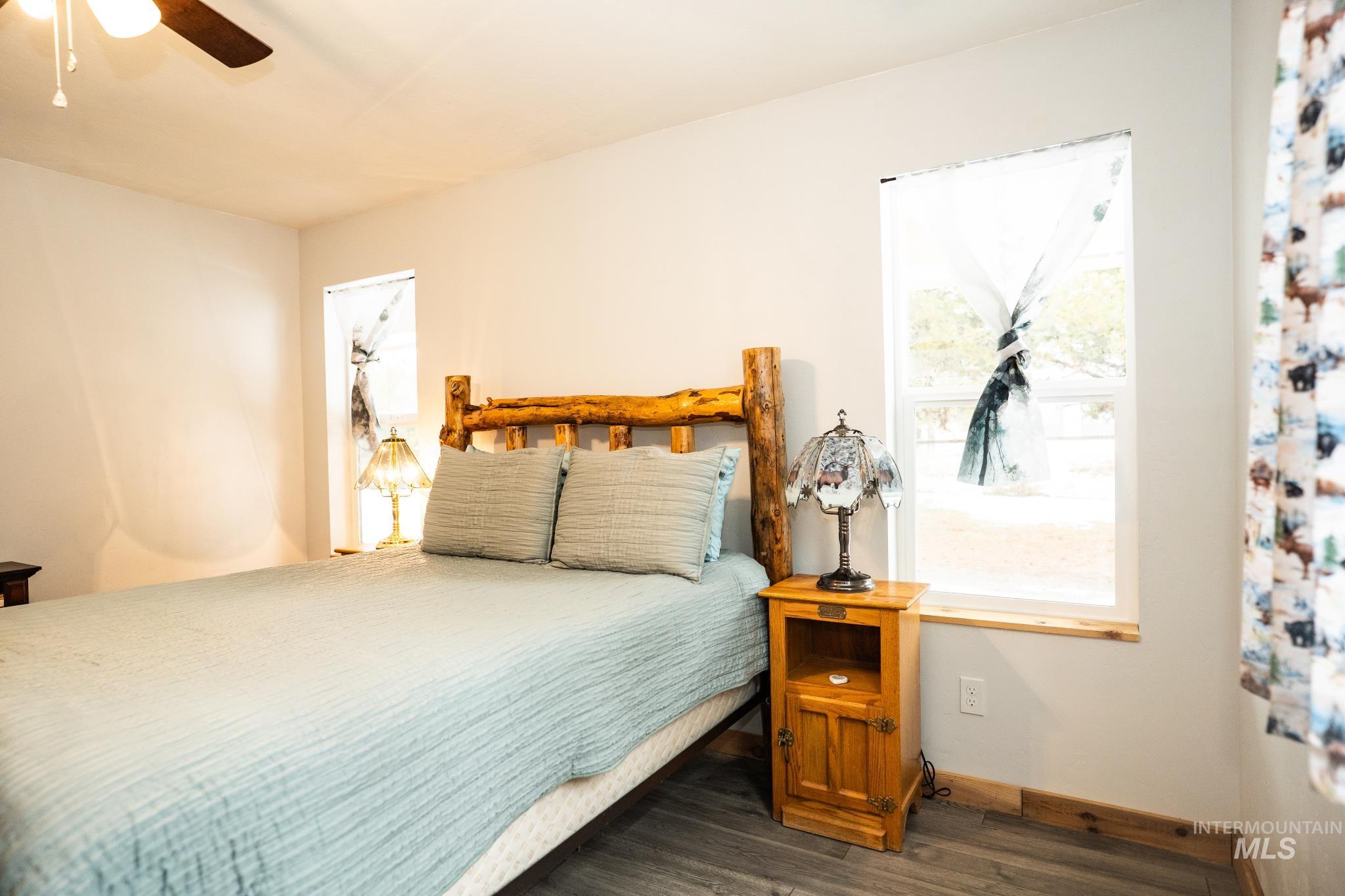 22 West Prospectors Drive Cascade, ID 83611 - Photo 18 of 25 Bedroom with wood finished floors and ceiling fan