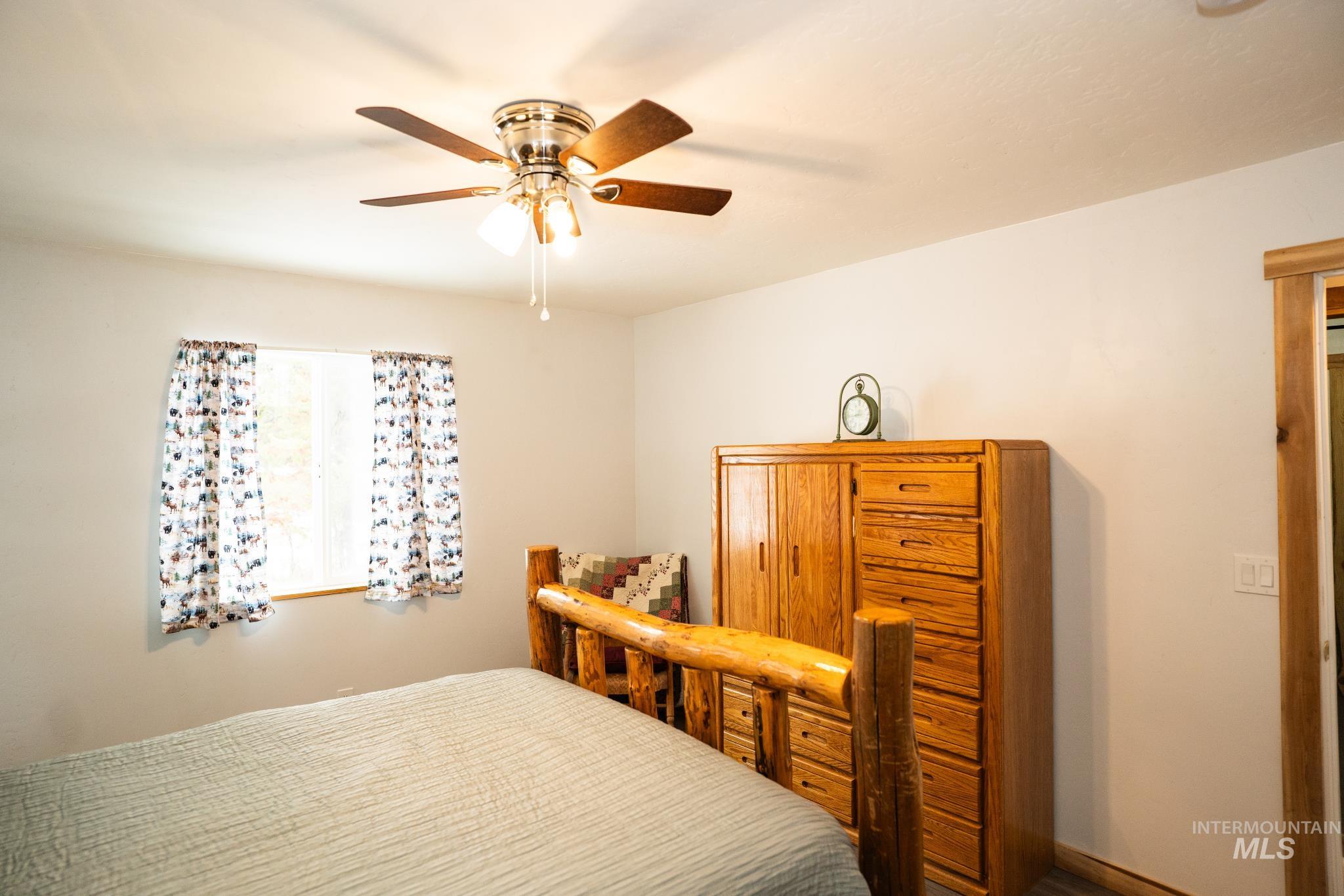 22 West Prospectors Drive Cascade, ID 83611 - Photo 19 of 25 Bedroom with ceiling fan and baseboards