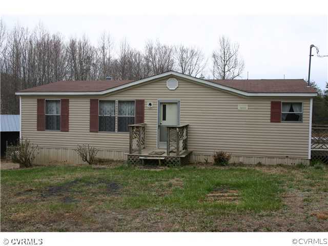 4900 Tabscott Road Kents Store, VA 23084 - Photo 1 of 9 a front view of a house with a garden