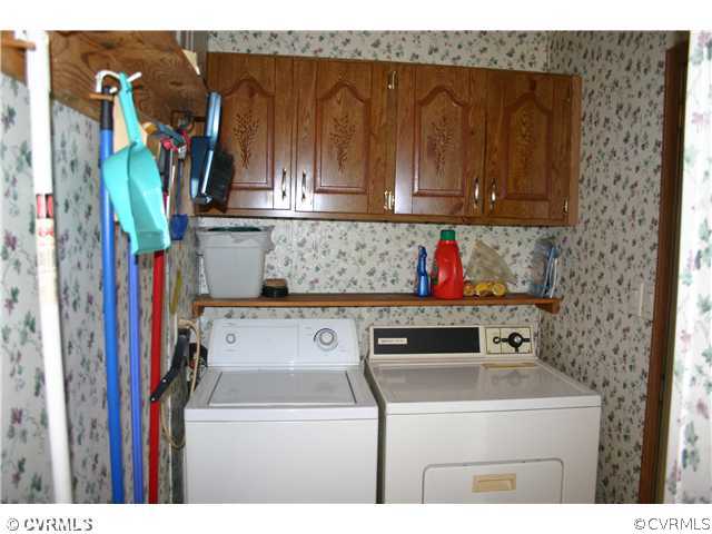 4900 Tabscott Road Kents Store, VA 23084 - Photo 7 of 9 a utility room with dryer and washer