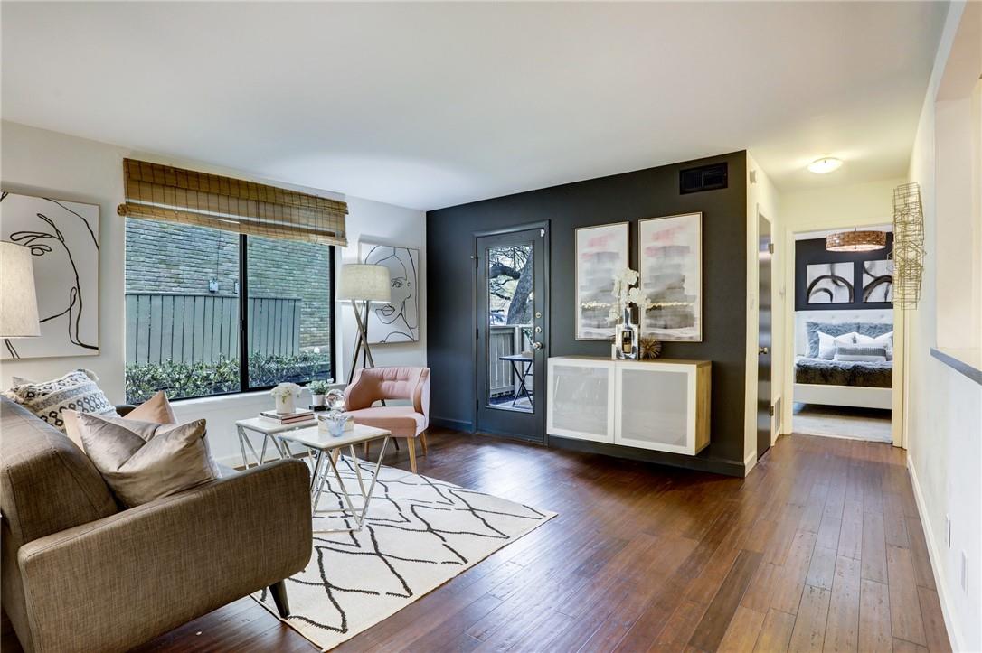 Living room with hardwood / wood-style floors