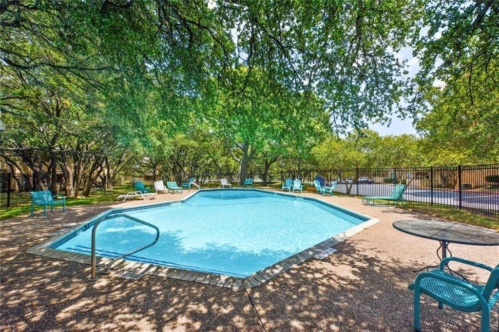 8210 Bent Tree Road, Unit 136 Austin, TX 78759 - Photo 14 of 20 Community pool featuring a patio and view of wooded area