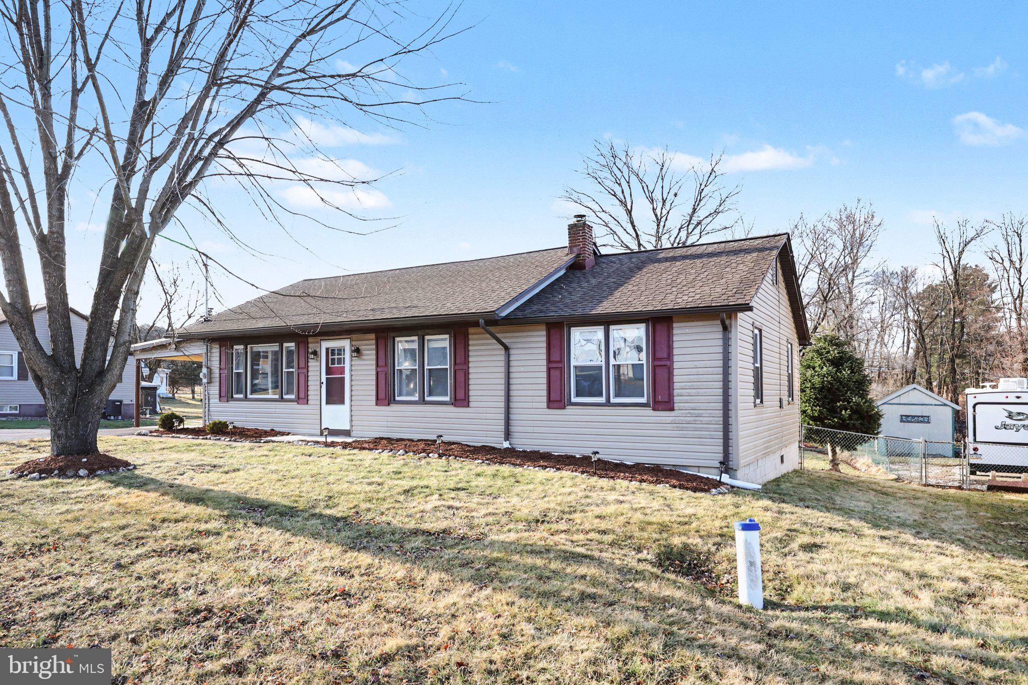 1002 Goodyear Road Gardners, PA 17324 - Photo 2 of 32 a front view of a house with a yard covered in snow