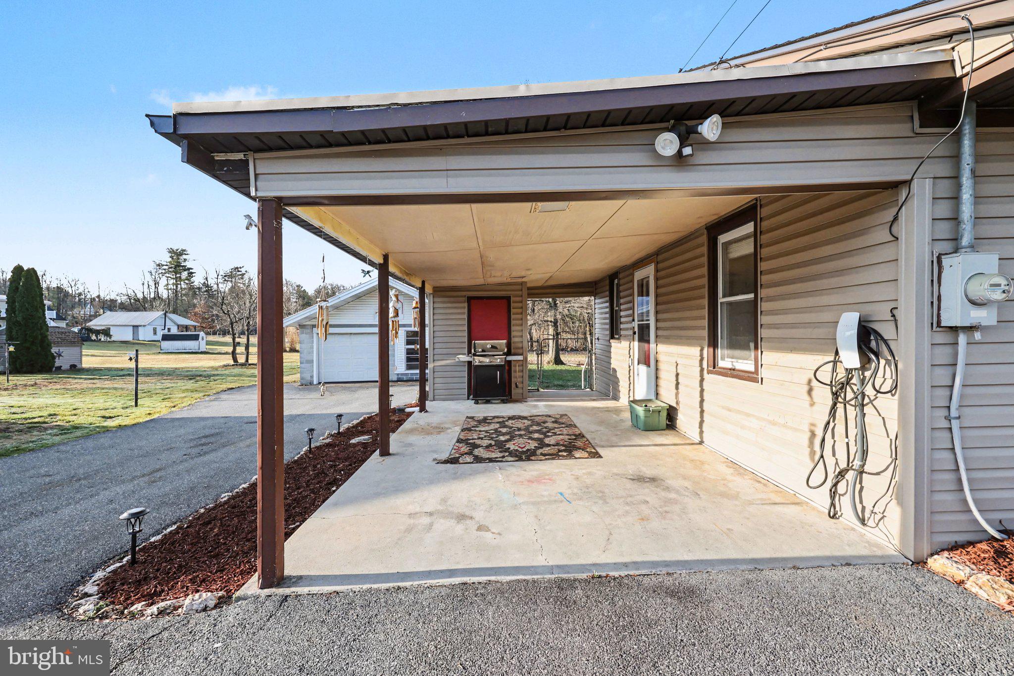 1002 Goodyear Road Gardners, PA 17324 - Photo 25 of 32 a view of a porch with a table and chairs