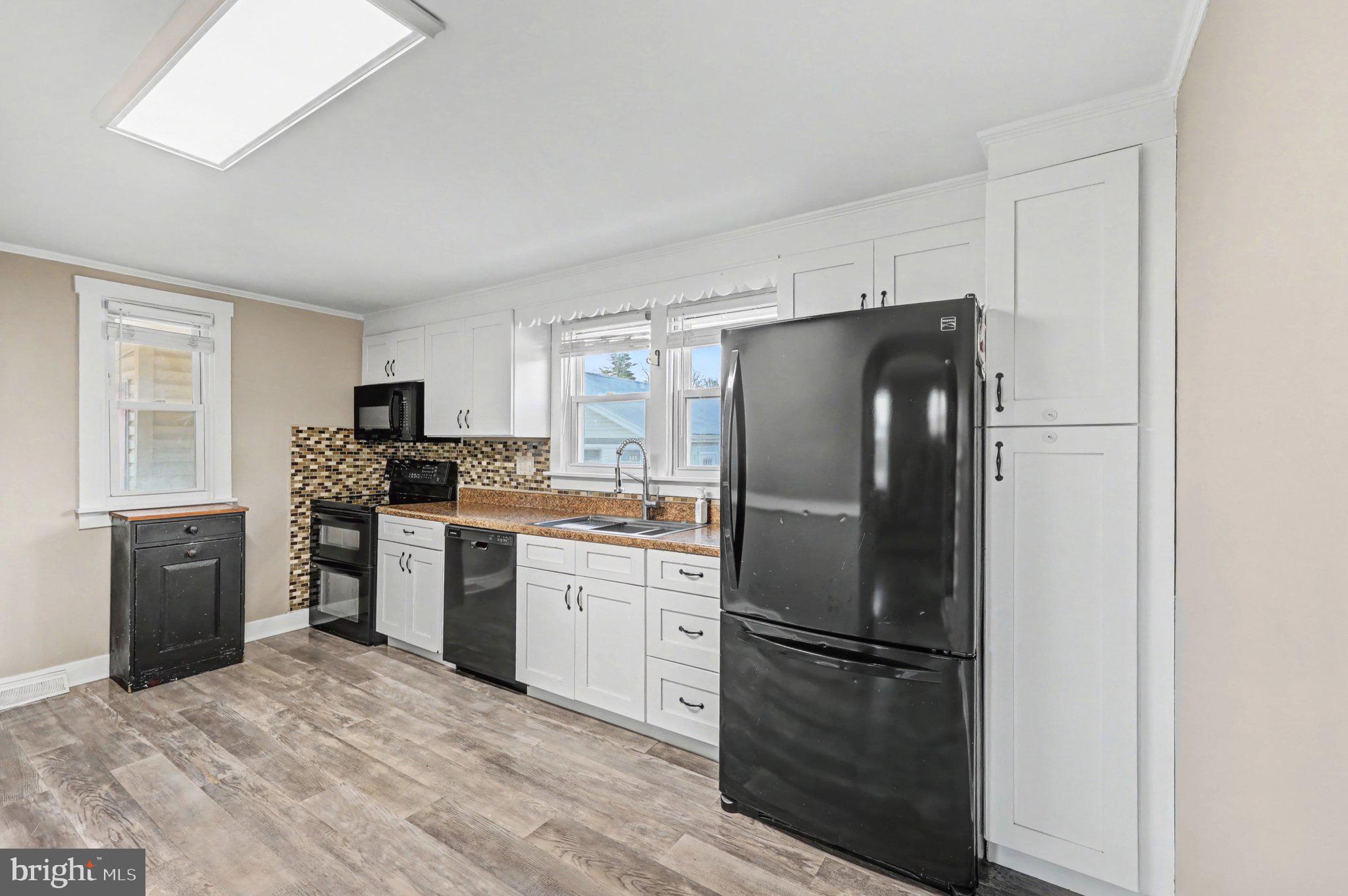 1002 Goodyear Road Gardners, PA 17324 - Photo 3 of 32 a kitchen with a refrigerator and a stove top oven