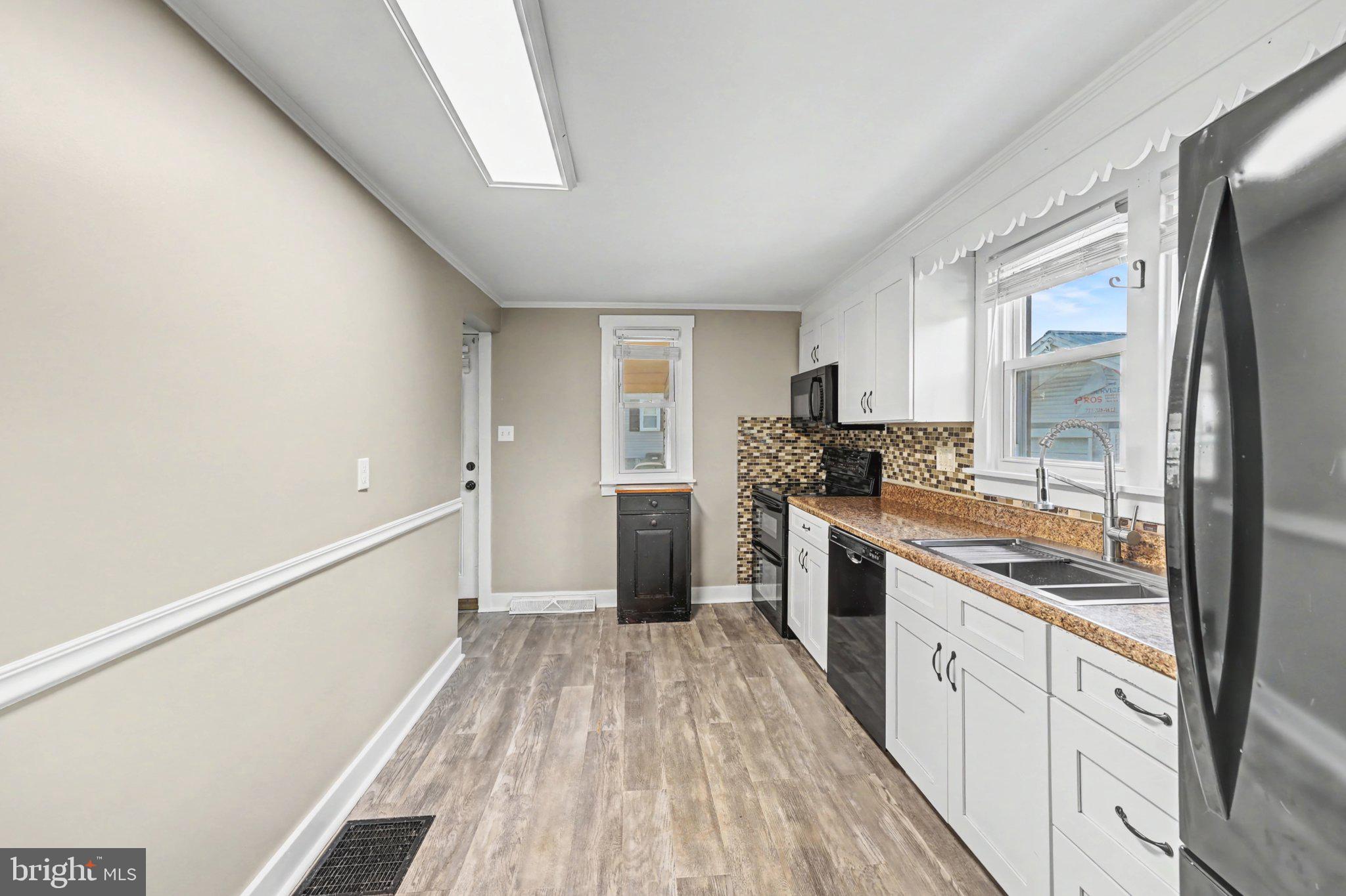 1002 Goodyear Road Gardners, PA 17324 - Photo 4 of 32 a kitchen with granite countertop a refrigerator stove top oven and sink