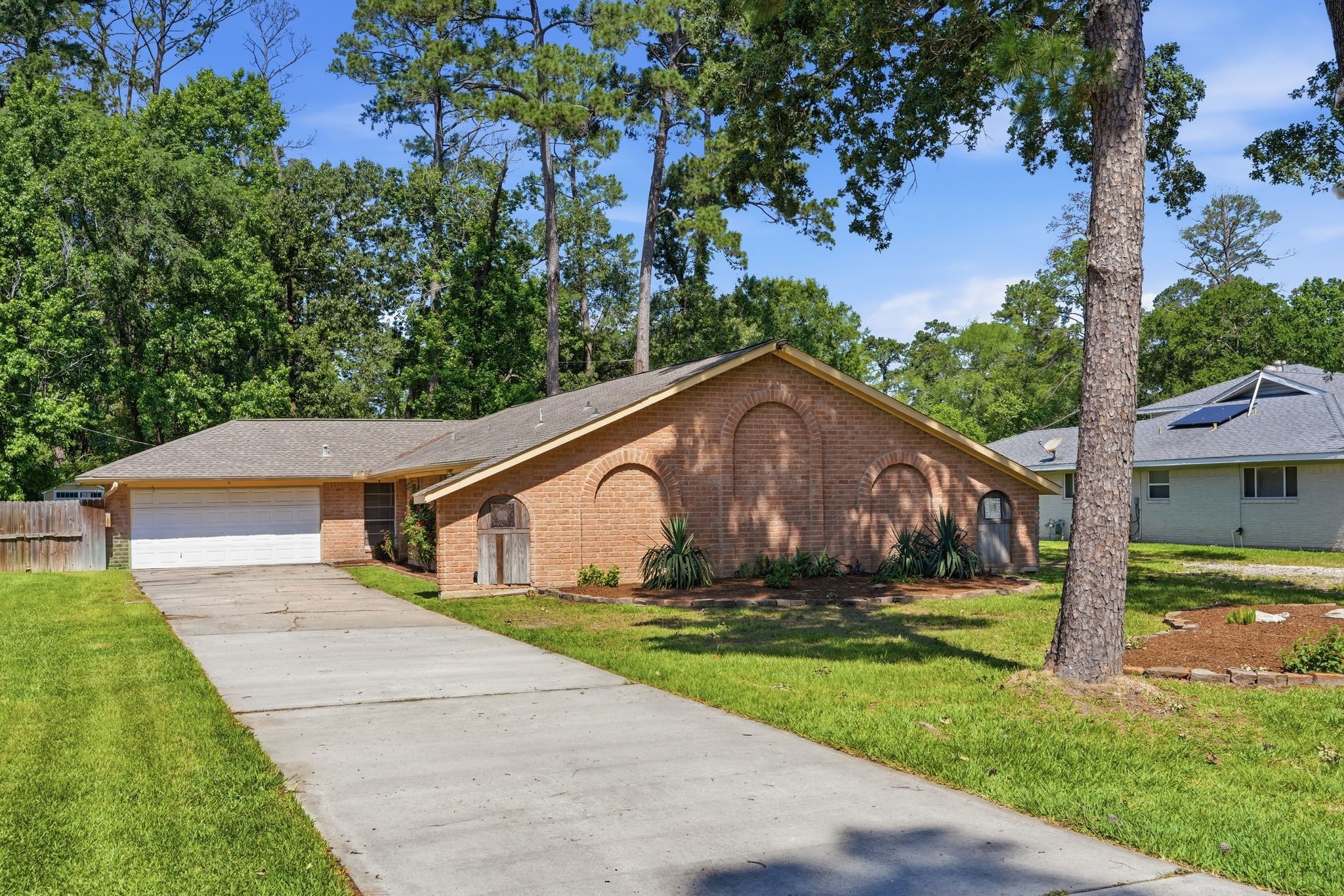 25611 Timberlane Drive Spring, TX 77386 - Photo 2 of 38 a house view with a garden