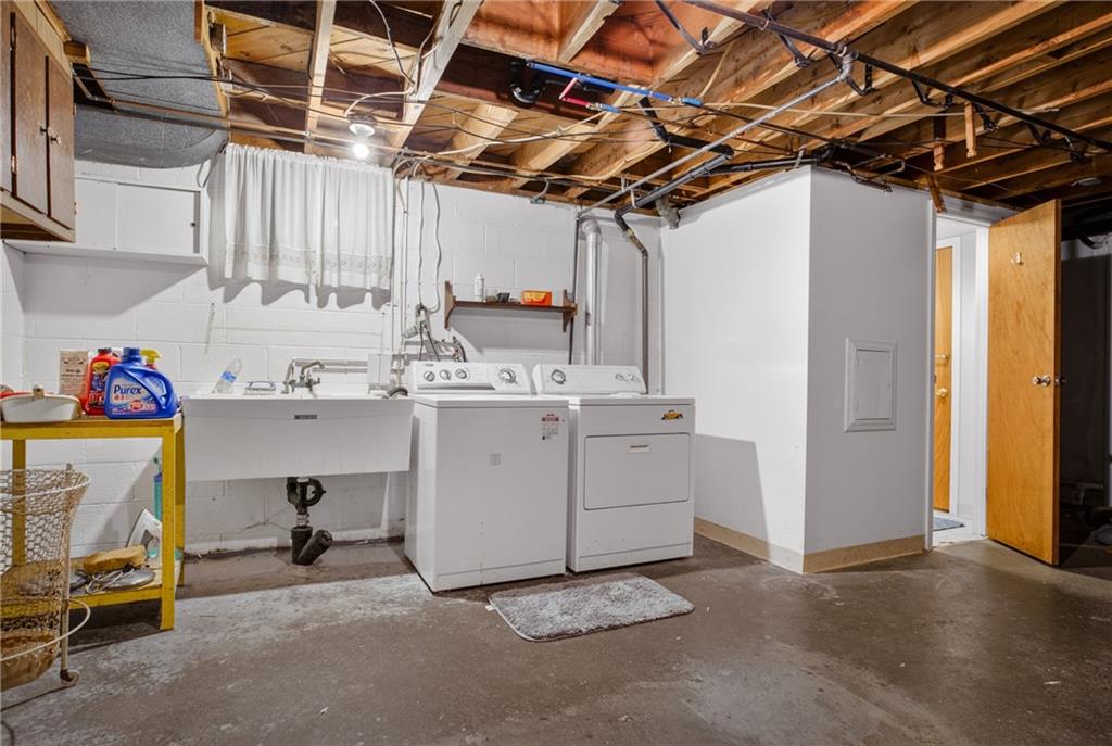 186 William Street McKees Rocks, PA 15136 - Photo 29 of 45 a utility room with cabinets dryer and washer