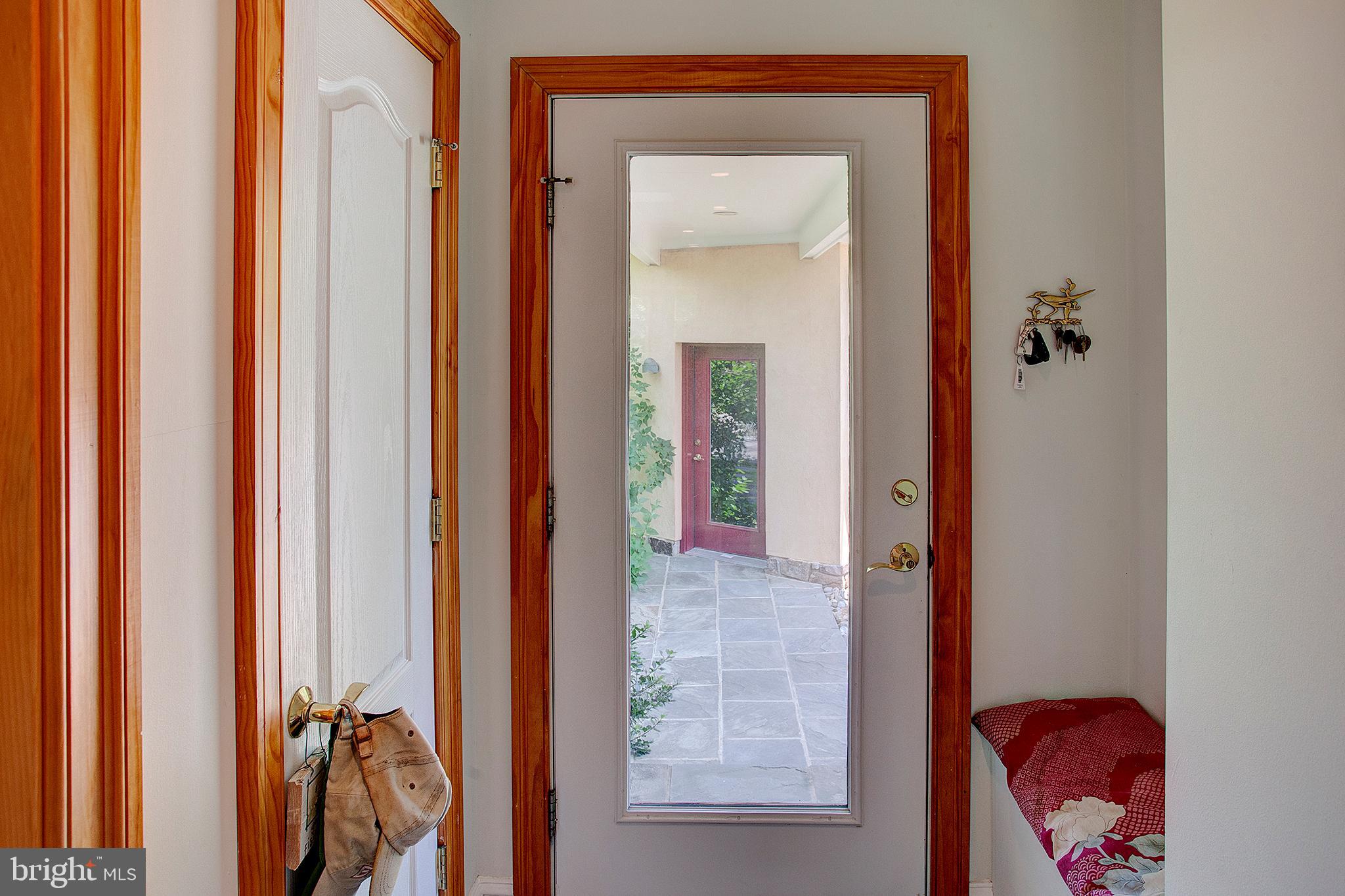 20781 Unison Road Round Hill, VA 20141 - Photo 32 of 64 Door to covered walk way to 3 car garage