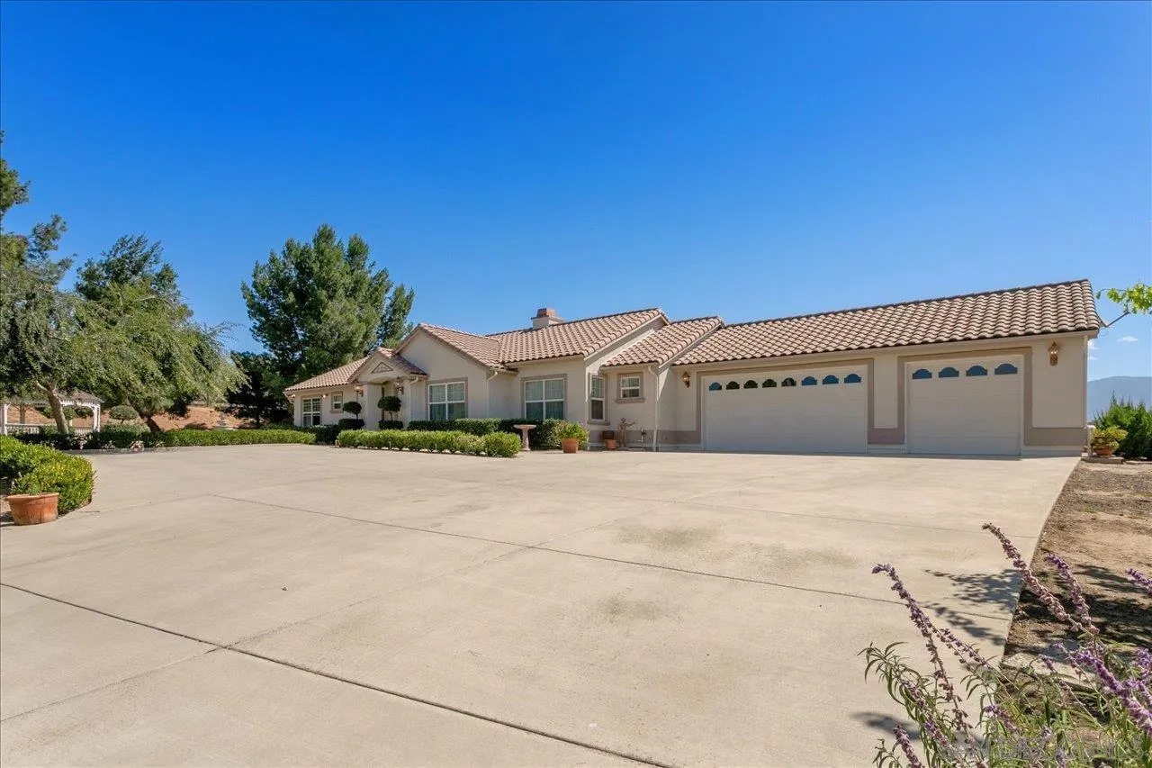 13669 Acorn Circle Valley Center, CA 92082 - Photo 2 of 33 a front view of a house with a yard