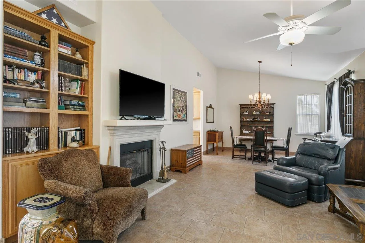 13669 Acorn Circle Valley Center, CA 92082 - Photo 21 of 33 a living room with furniture a fireplace and a flat screen tv