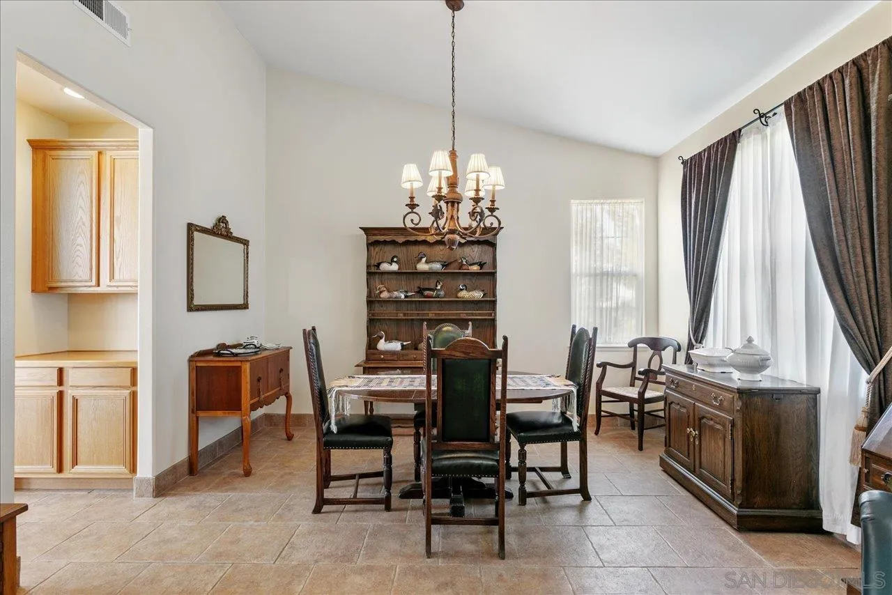 13669 Acorn Circle Valley Center, CA 92082 - Photo 22 of 33 a dining room with furniture and window