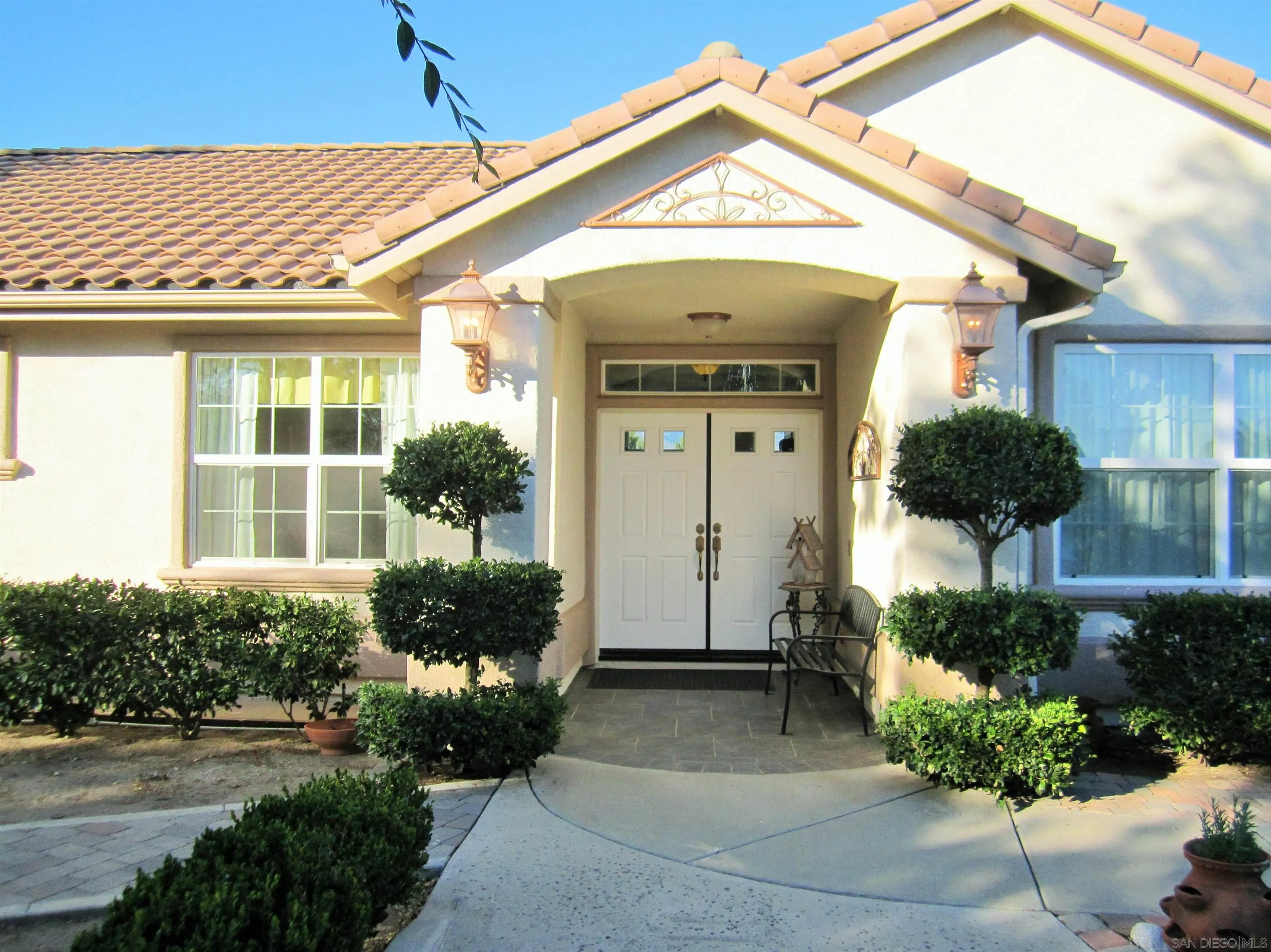 13669 Acorn Circle Valley Center, CA 92082 - Photo 3 of 33 a front view of a house with a yard