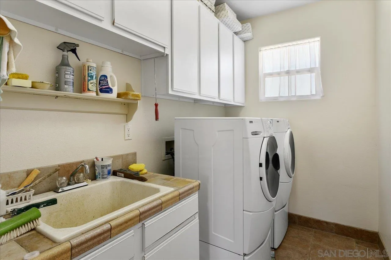 13669 Acorn Circle Valley Center, CA 92082 - Photo 31 of 33 a utility room with sink dryer and washer