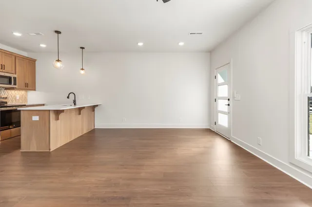 a bathroom with a toilet sink and a mirror