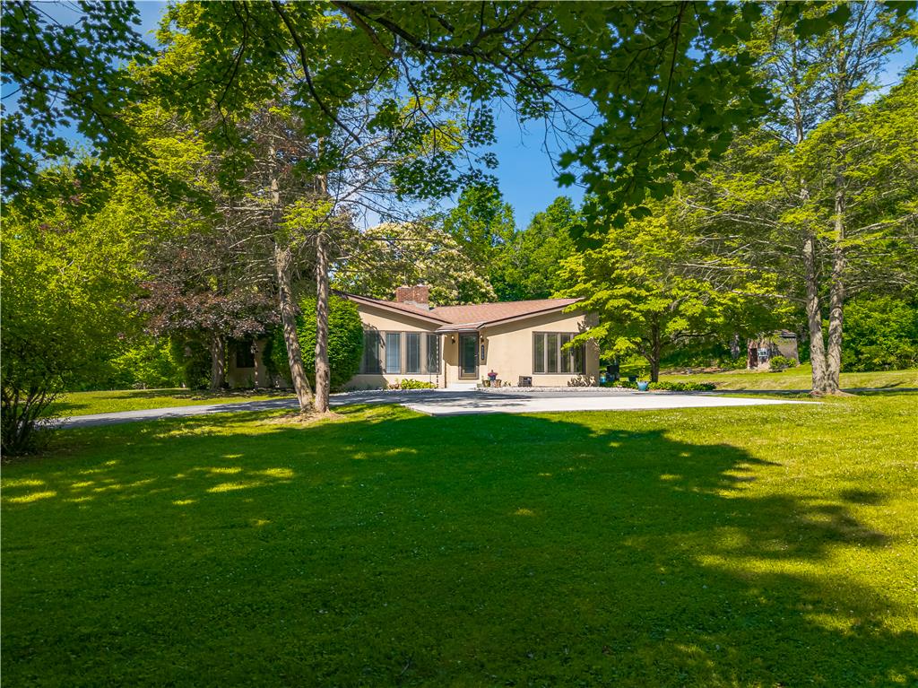 5735 Blue Church Road Coopersburg, PA 18036 - Photo 1 of 36 Mature trees frame this inviting residence, showcasing a well-maintained lawn and private driveway.