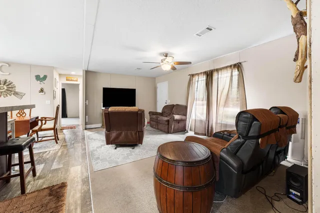 a kitchen with refrigerator and cabinets