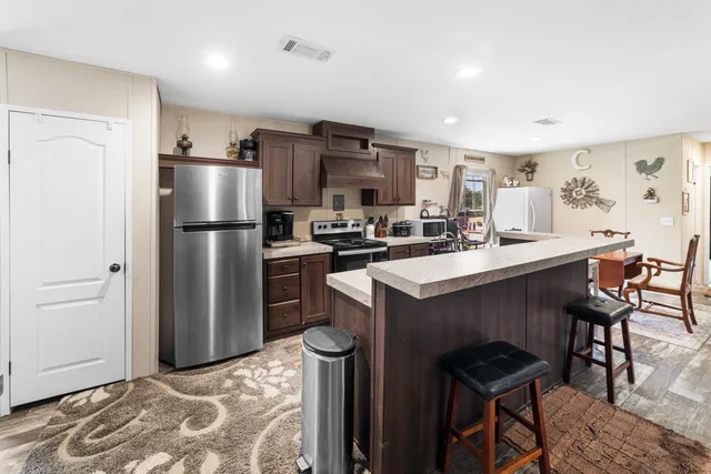 a dining room with furniture and a window