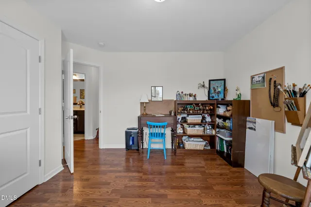 a view of a livingroom with furniture and an empty room